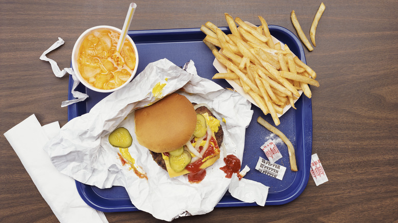 fries, soda, straw, burger, blue platter, white napkin