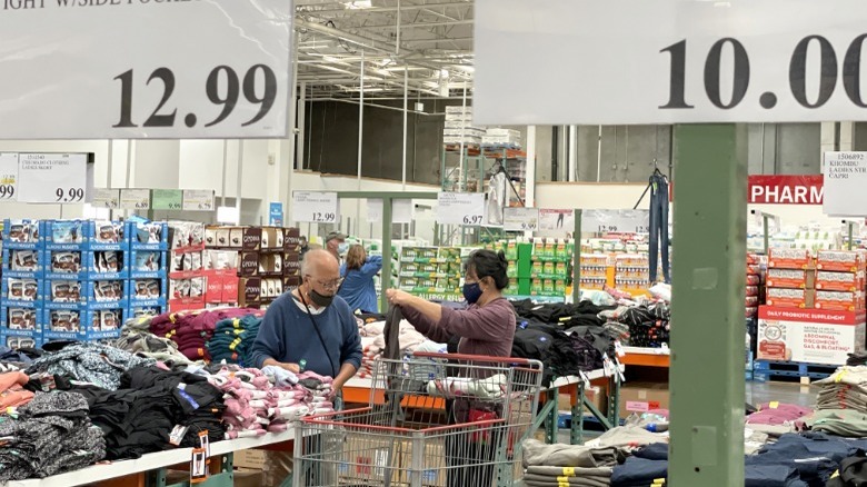 couple shopping for clothes at Costco