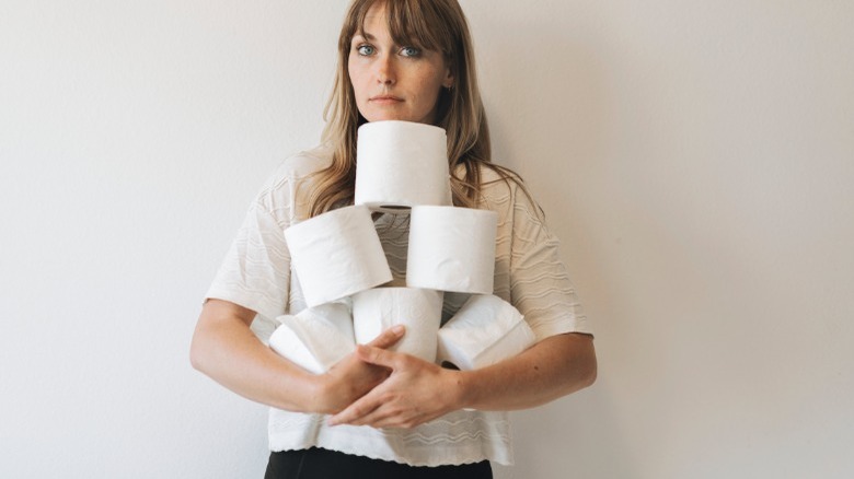 woman holding toilet paper