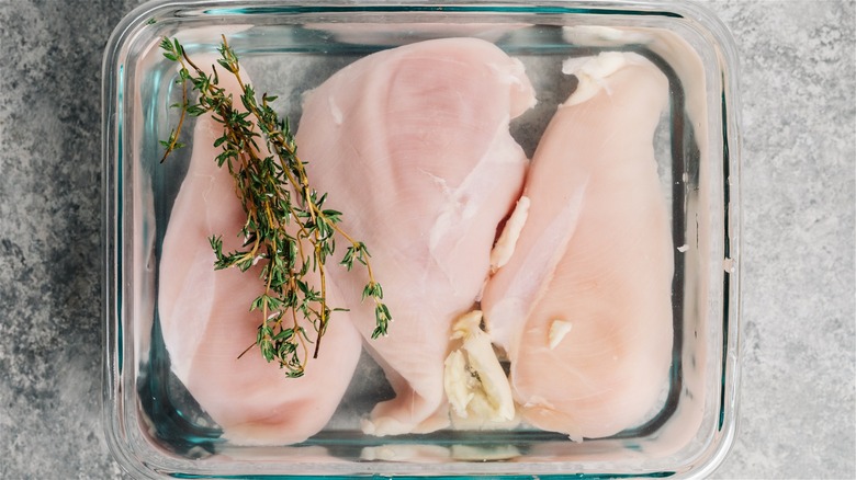Chicken breasts in a brine