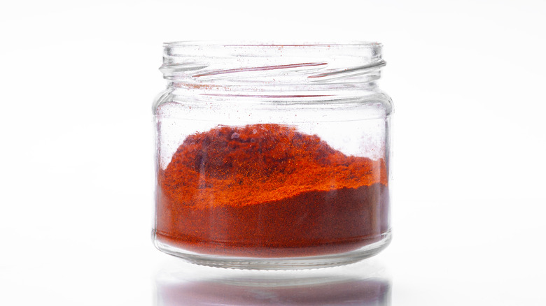 Small open jar of paprika