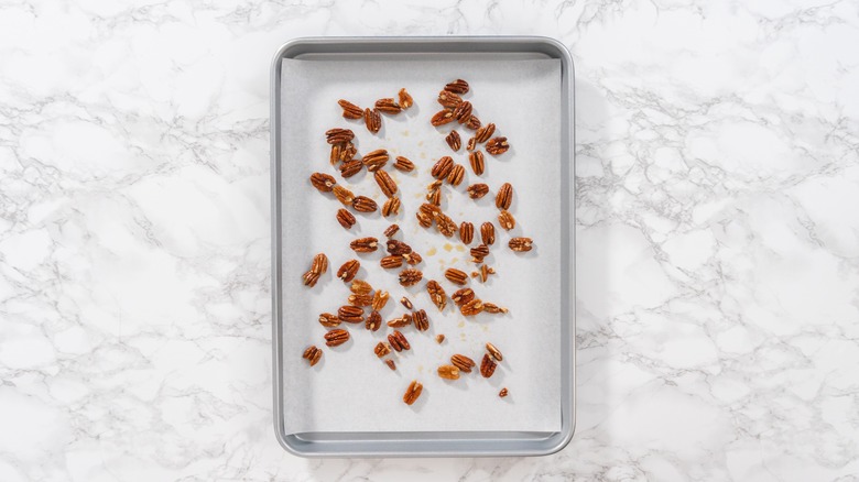 Pecans on lined sheet pan