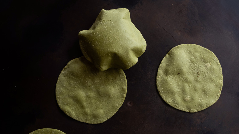 green tortillas with one puffing up