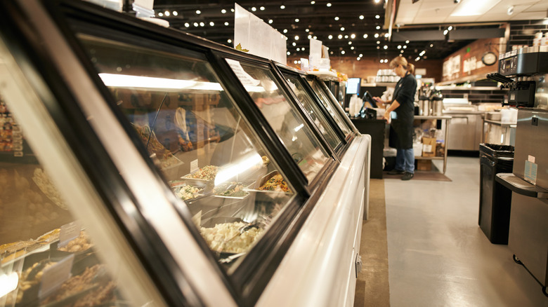 supermarket deli behind the counter