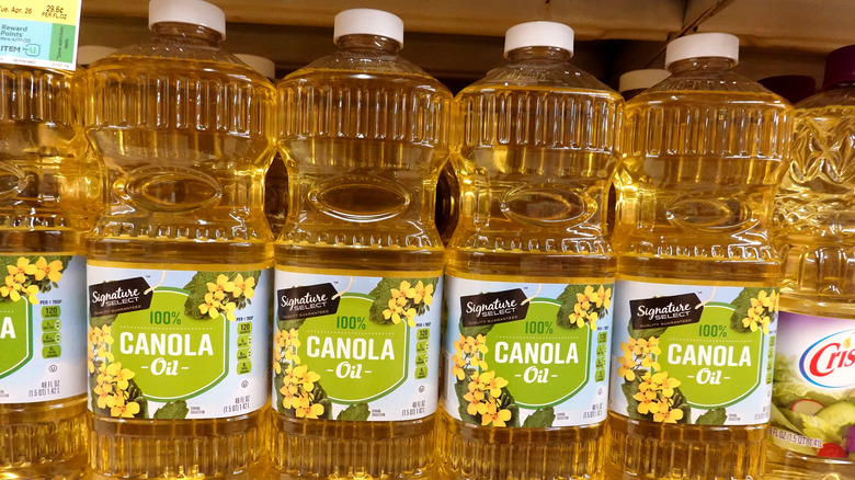 bottles of canola oil on shelf