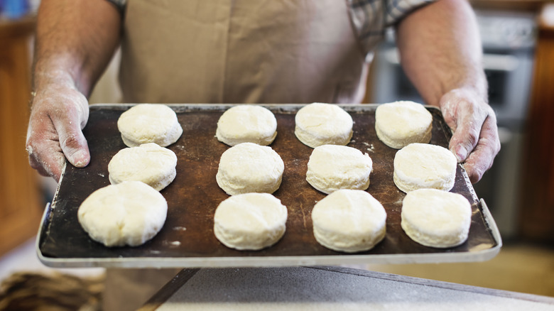 Person holding tray with scones