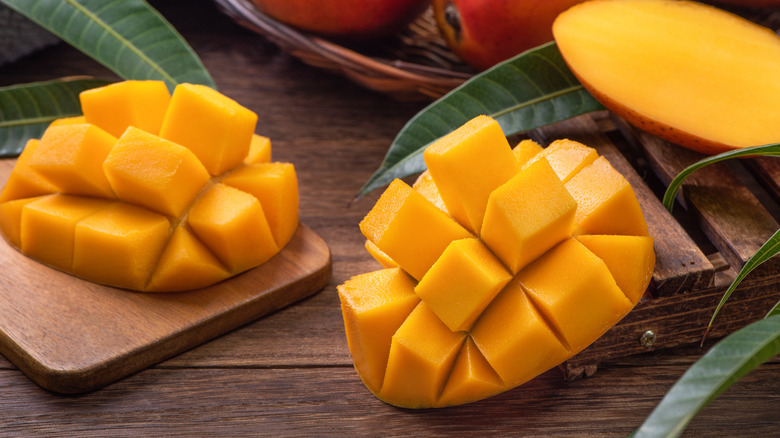 mangoes on cutting board