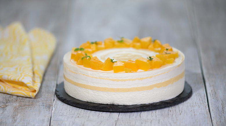 orange fruit on white cake 