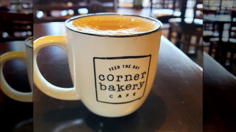 Corner Bakery latte on table