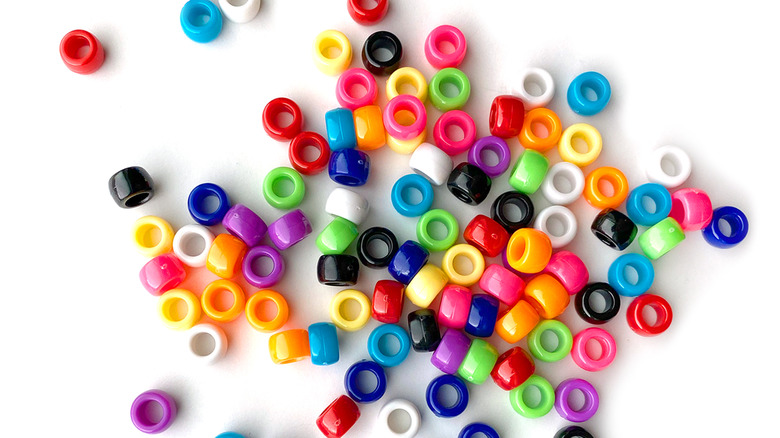 Colorful beads on white background