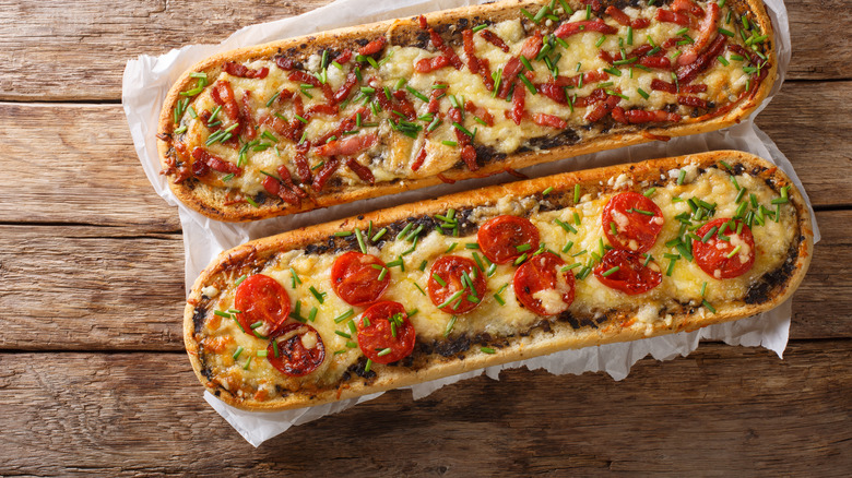 long open-faced sandwiches on wooden background