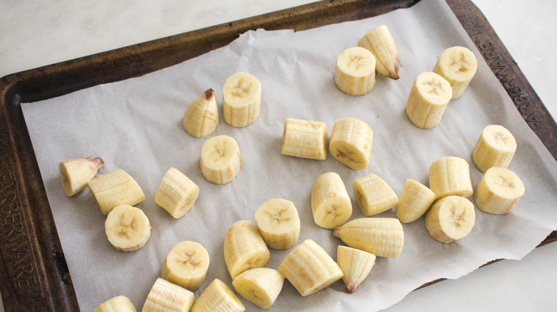 frozen banana slices on cookie sheet