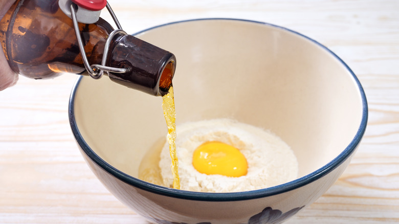 Beer being poured into batter mixture