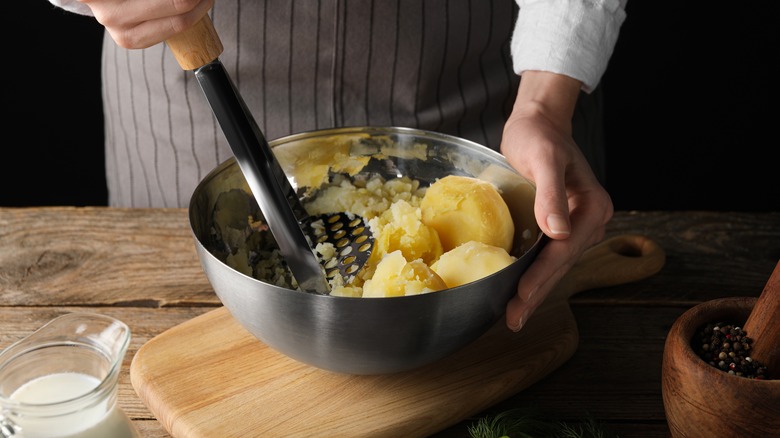 person making mashed potato