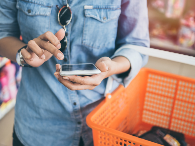 Talking on the phone or texting during checkout