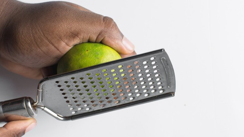 Person grating fresh lime