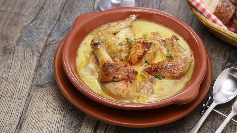 creamy chicken in clay bowl