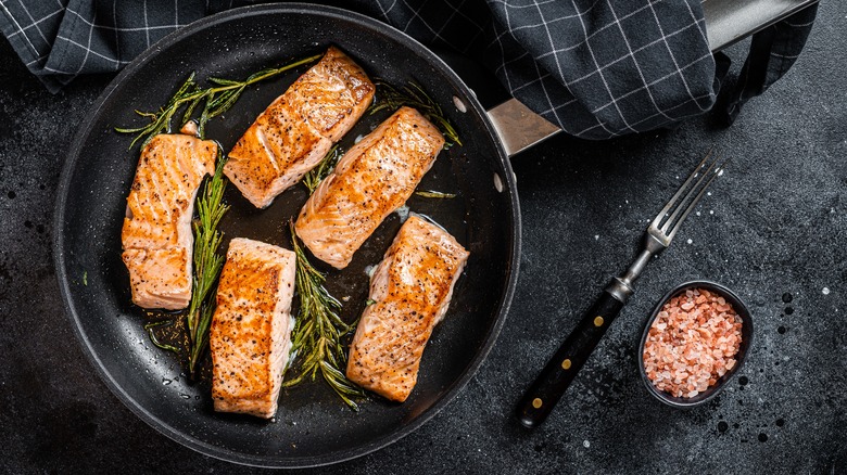 cooked salmon steaks in pan