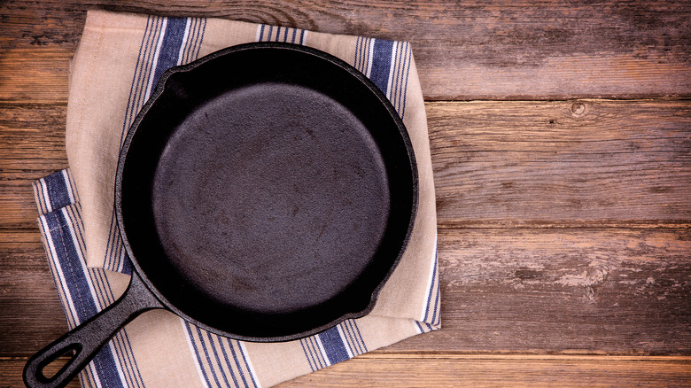 cast-iron skillet on tea towel