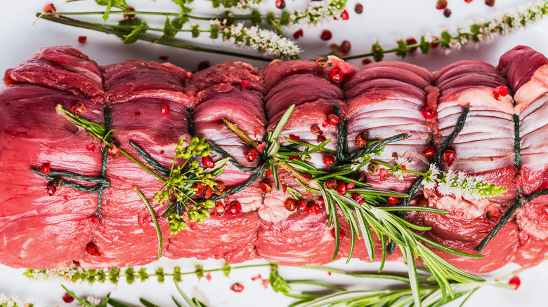 Trussed beef tenderloin plated