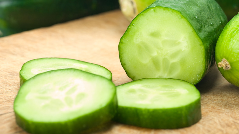 sliced cucumber on cutting board