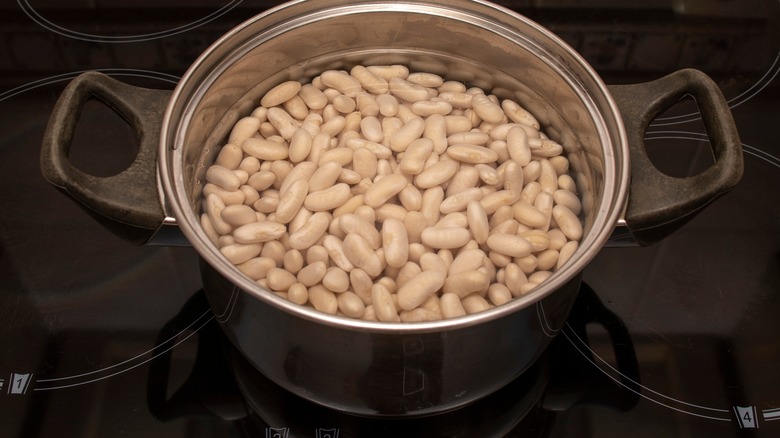 navy beans soaking in water