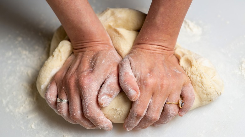 Kneading pie dough by hand