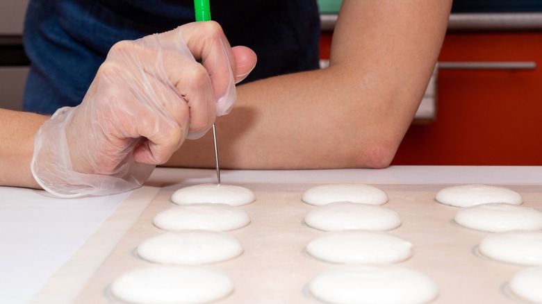 Popping macaron air bubbles