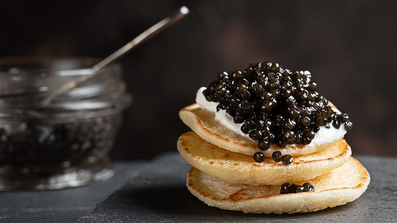 sour cream and caviar on pancakes