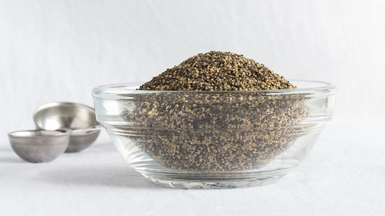 Ground black pepper in bowl