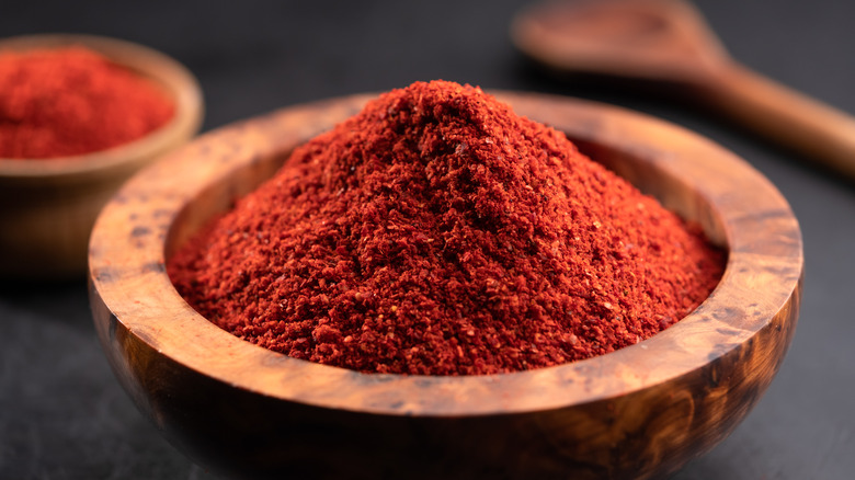 Chili powder in wooden bowl