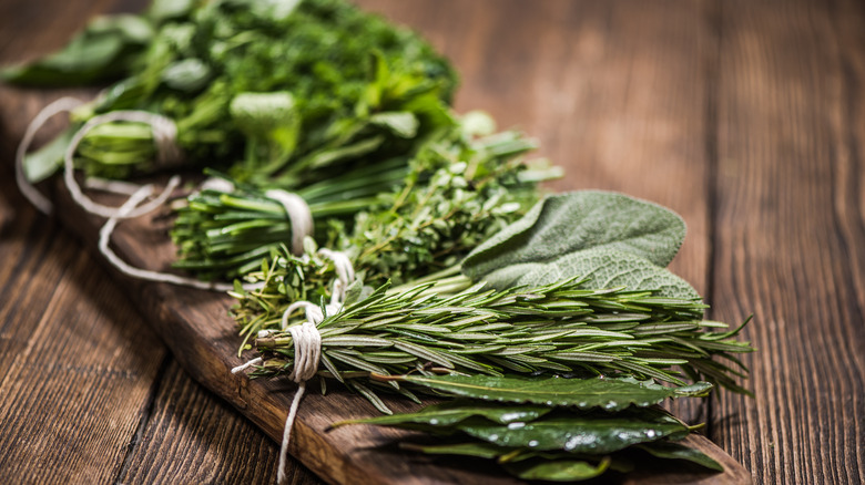 Fresh herbs on wooden board