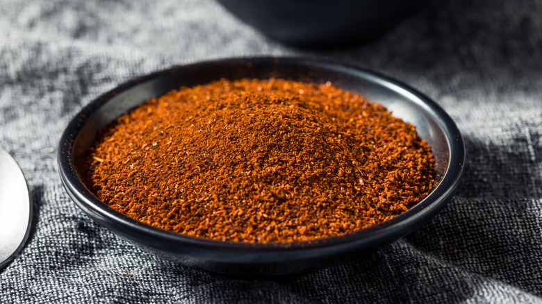 Smoked paprika in black bowl