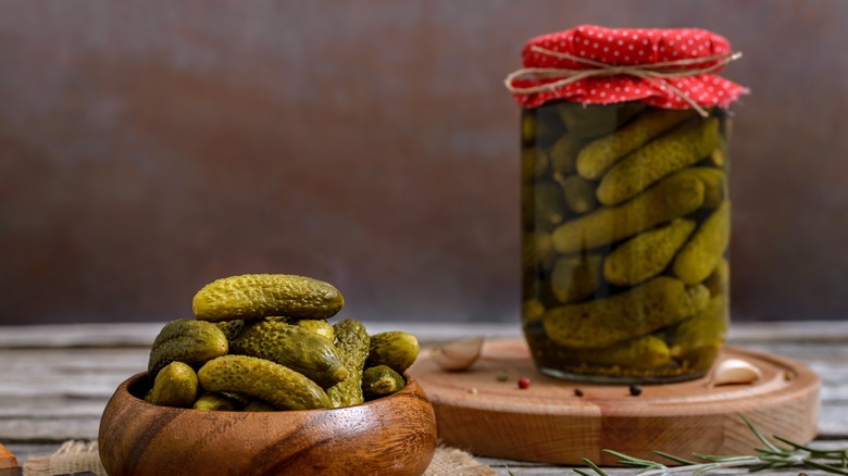 Cornichons in jar and bowl