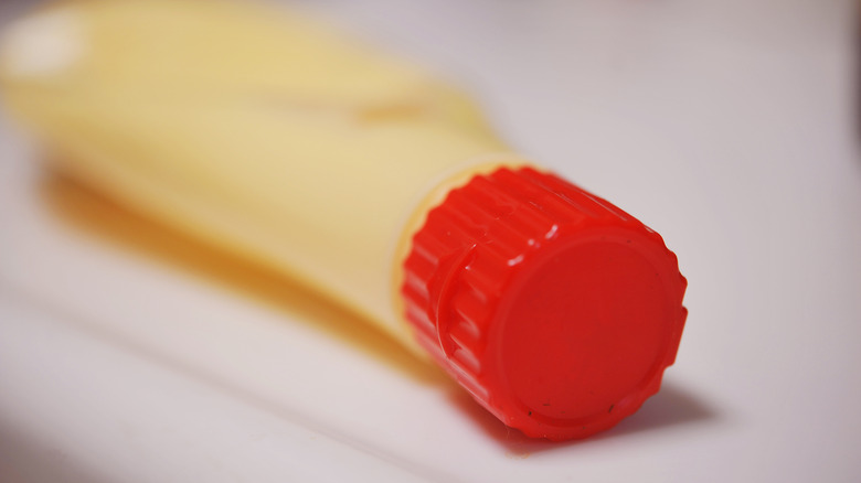 Mayonnaise in bottle with red cap