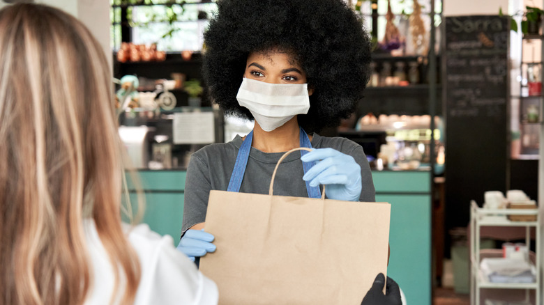 Woman holding take out bag