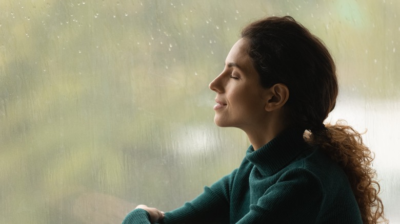 Woman relaxing with eyes closed