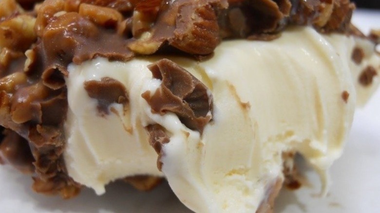 A hand dipped ice cream bar with a bite