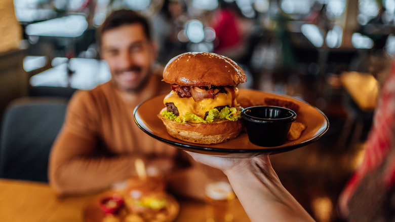 burger on plate being served