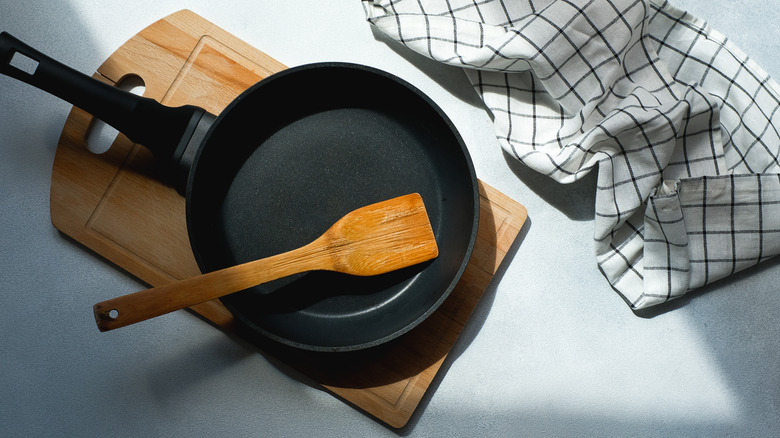 iron skillet with wooden spatula