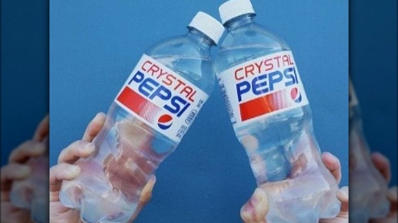 Two Crystal Pepsi bottles