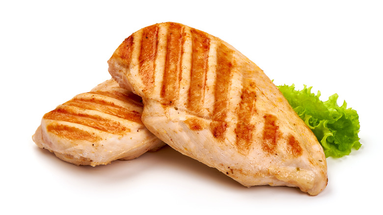 two grilled chicken breasts