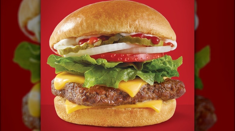 Wendy's Cheeseburger on red background