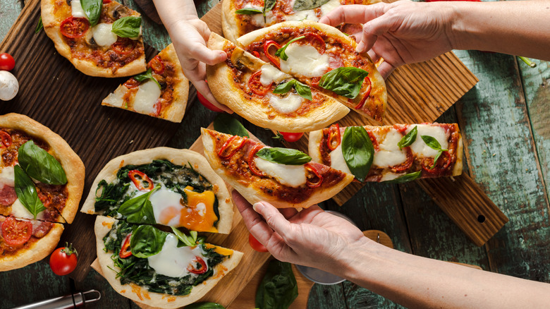 Variety of pizza on table