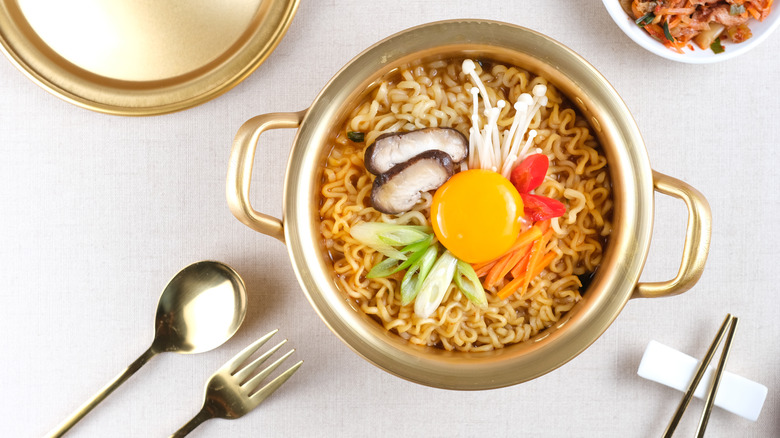 Egg yolk in noodle bowl 