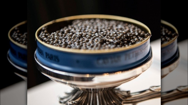 Petrossian caviar tin on stand