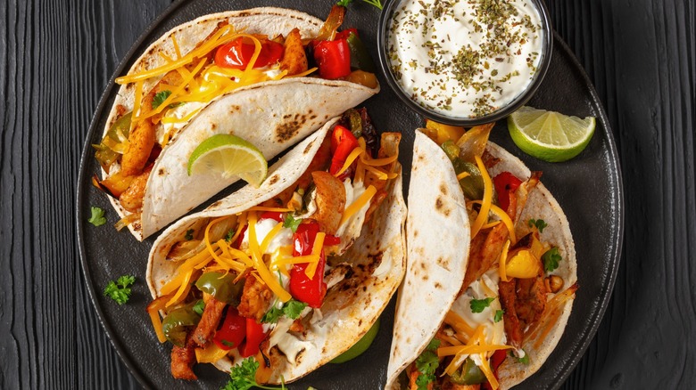 fajita tacos on black plate