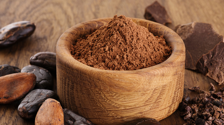 Wooden bowl of cocoa powder