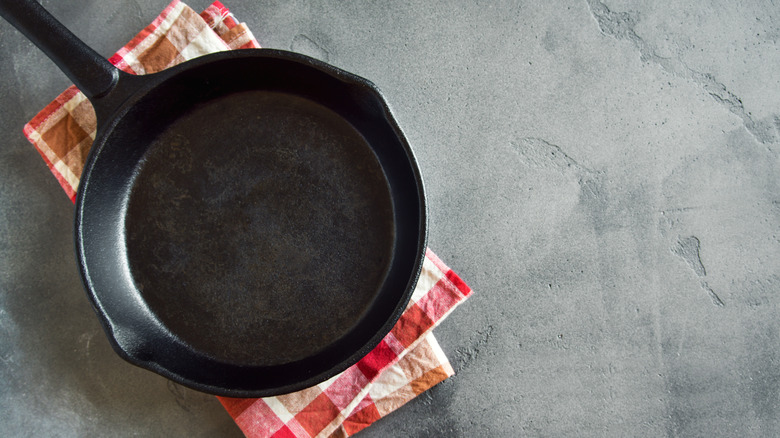 cast iron skillet on towel