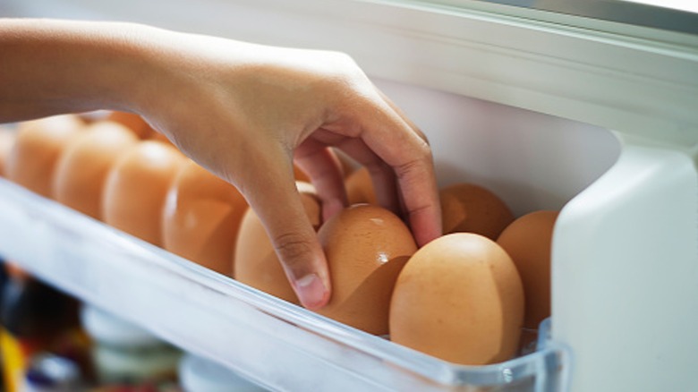 Grabbing eggs from the refrigerator